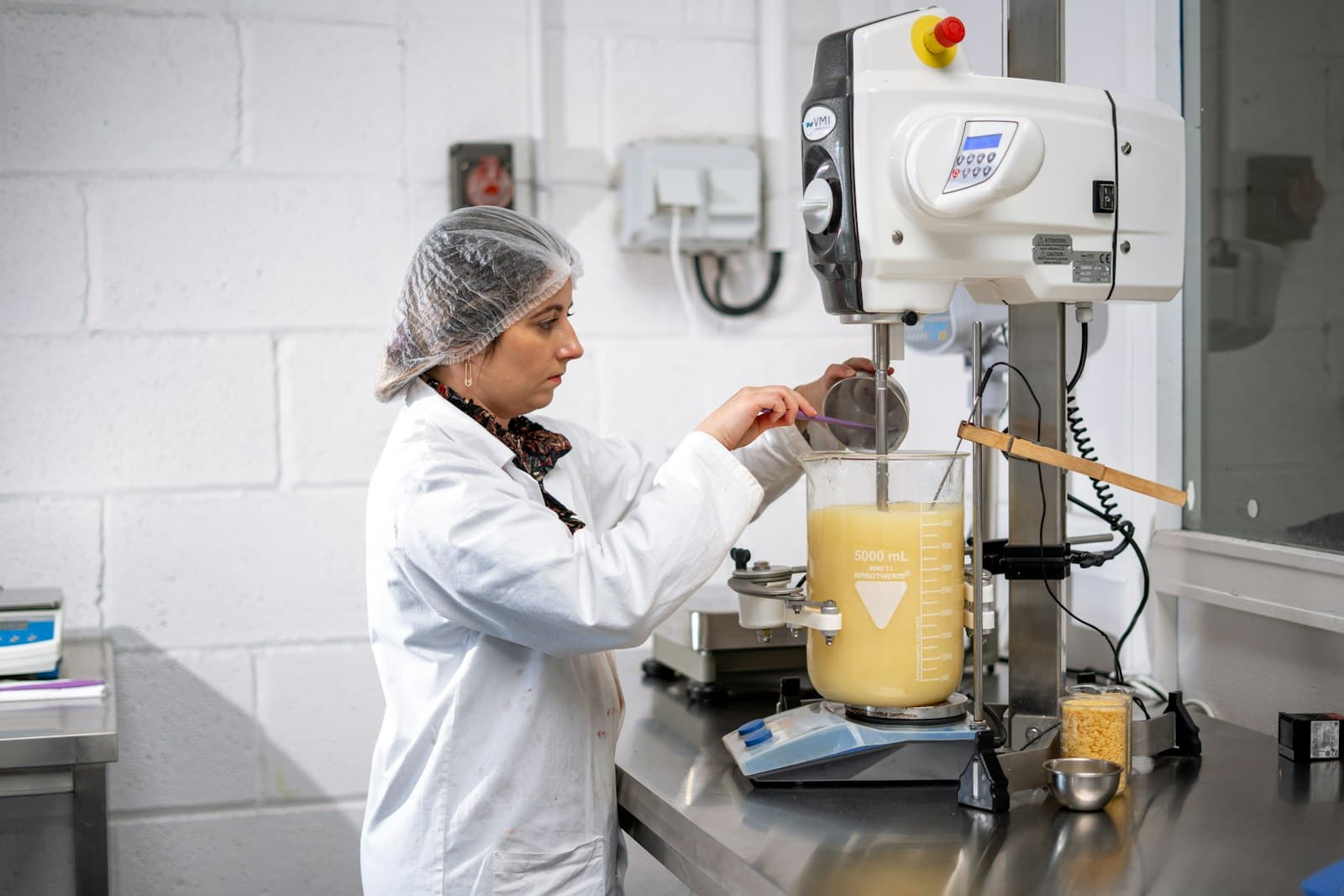 Specialist preparing a product sample in a laboratory