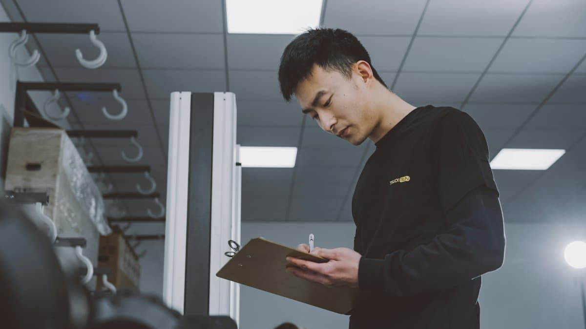 Quality inspector with a clipboard in a warehouse
