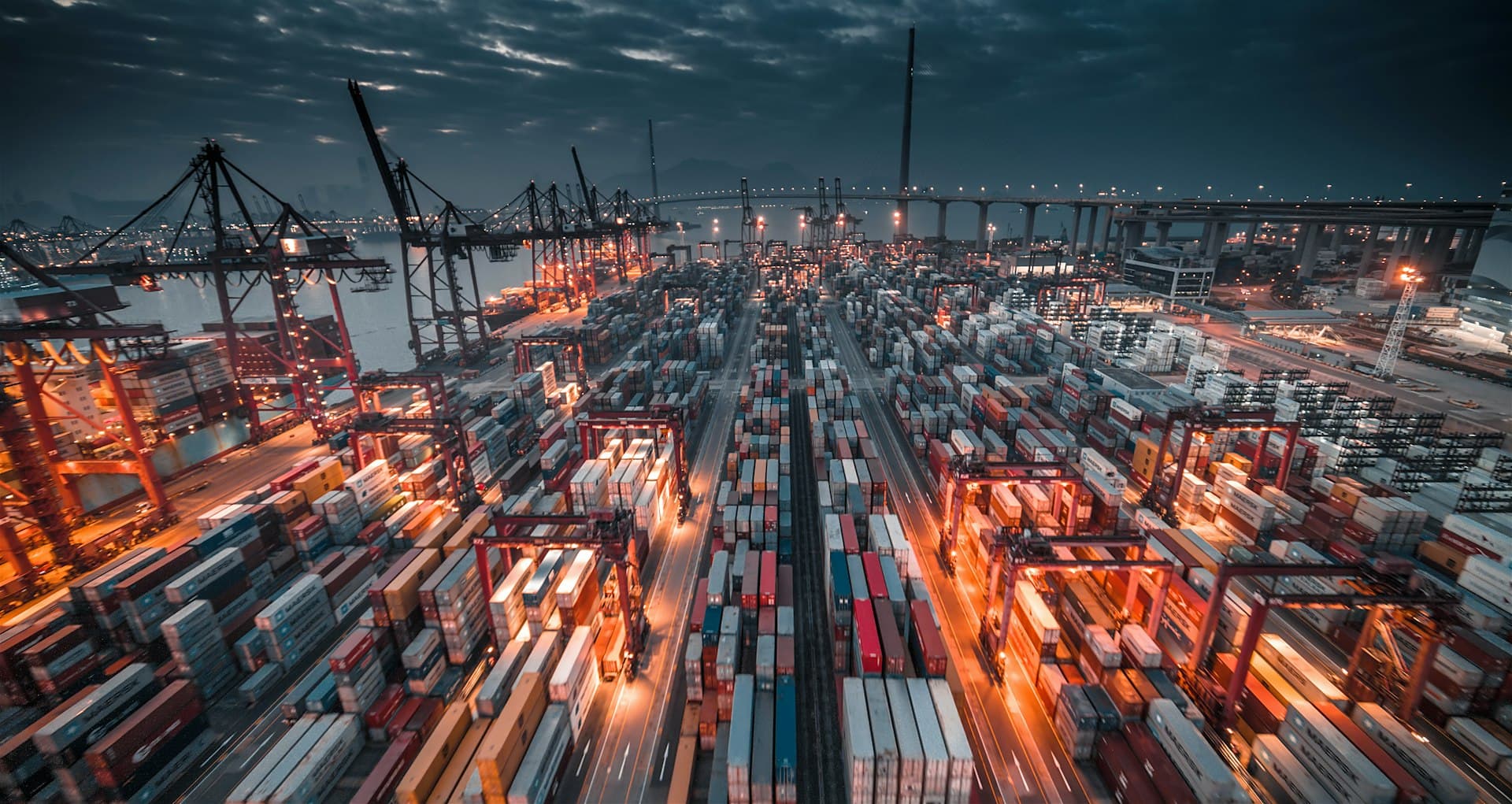 Container port and cranes at dusk