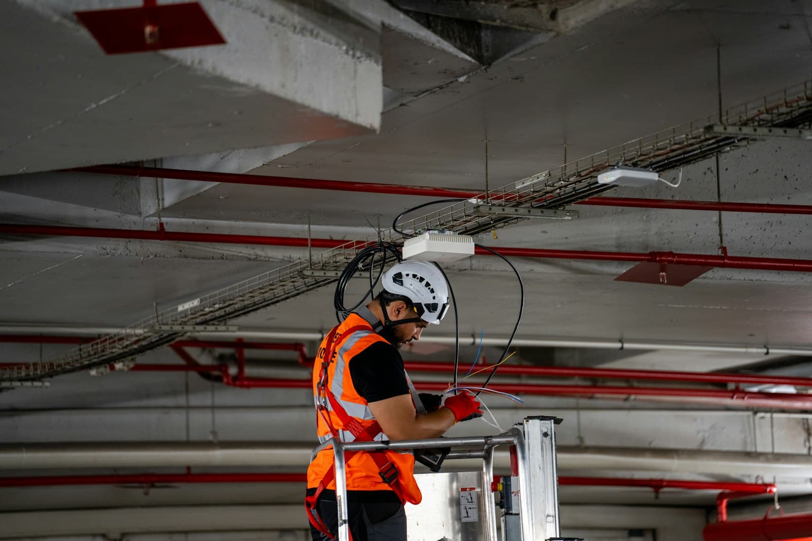 Technician working with a helmet and safety vest